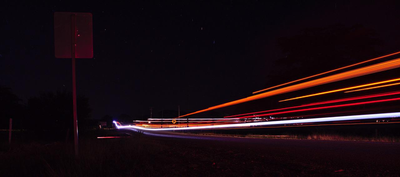 Blur of lights along road at night.