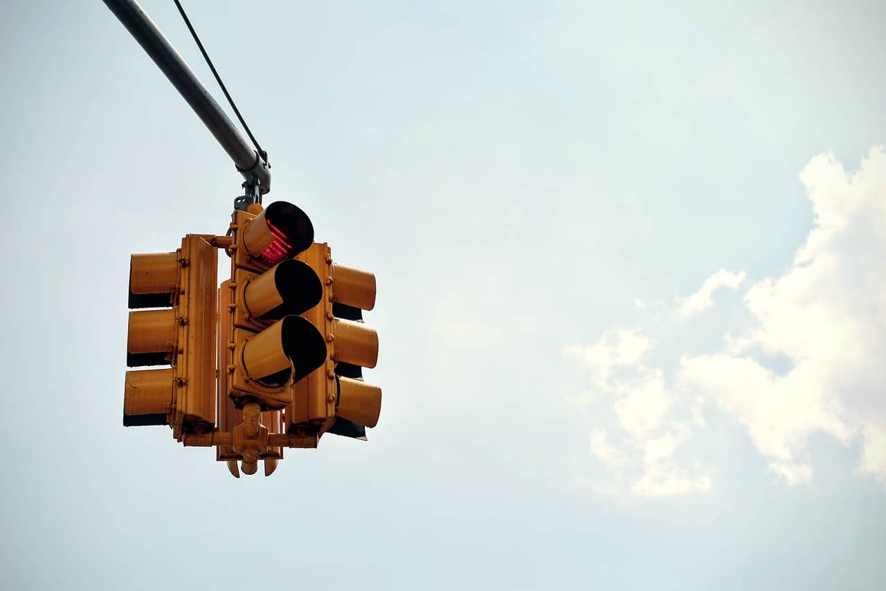 Traffic light facing four different directions.